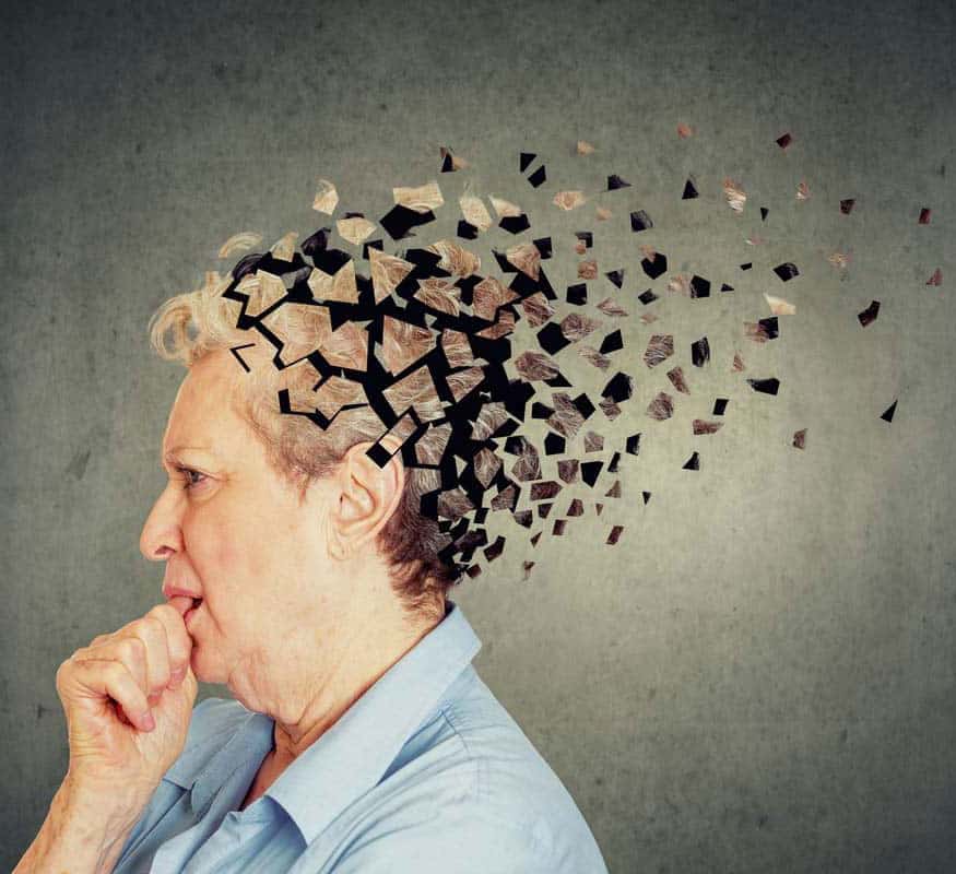 woman with the back of her head floating away in pieces, representing memory loss